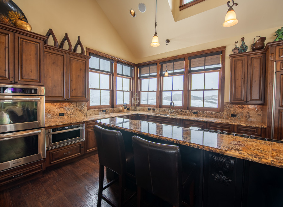 This stunning kitchen boasts a spacious island with seating, perfect for entertaining.