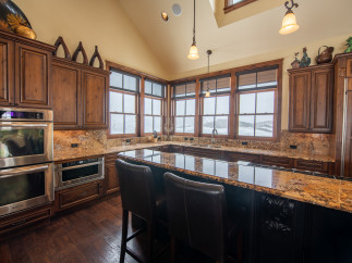 This stunning kitchen boasts a spacious island with seating, perfect for entertaining.