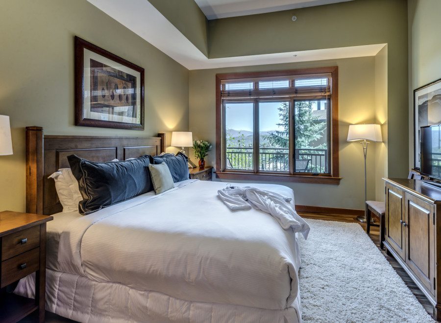 Experience luxury in this stunning bedroom, featuring a plush king-sized bed and elegant decor.