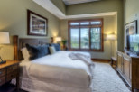 Experience luxury in this stunning bedroom, featuring a plush king-sized bed and elegant decor.