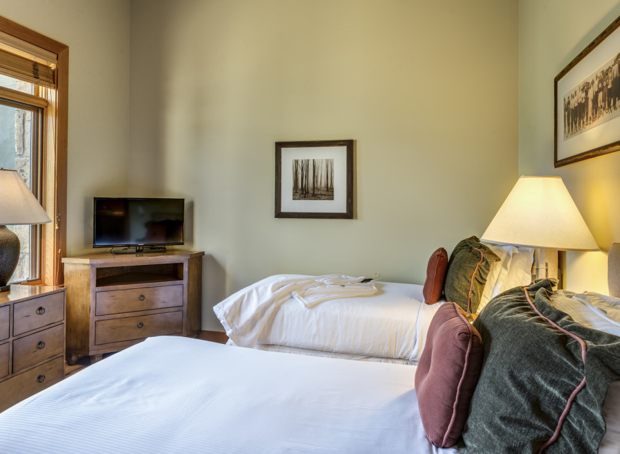 Cozy bedroom with two beds, perfect for a comfortable stay.