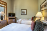 Cozy bedroom with two beds, perfect for a comfortable stay.