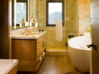 This luxurious bathroom boasts a modern design with warm, inviting tones.