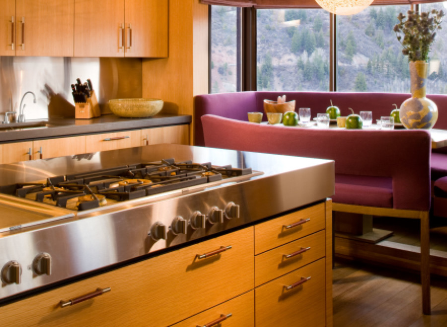 This modern kitchen boasts sleek stainless steel appliances and custom cabinetry.