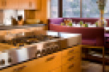 This modern kitchen boasts sleek stainless steel appliances and custom cabinetry.
