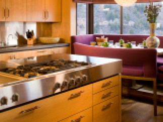 This modern kitchen boasts sleek stainless steel appliances and custom cabinetry.