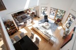 This stunning home boasts a spacious open-plan living area with hardwood floors and abundant natural light.