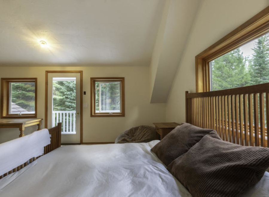 Discover a cozy bedroom retreat with stunning views.