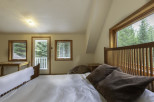 Discover a cozy bedroom retreat with stunning views.