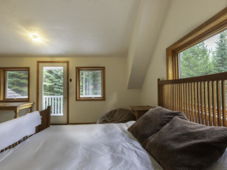 Discover a cozy bedroom retreat with stunning views.