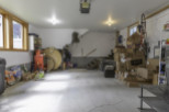 Discover the potential of this spacious garage, perfect for storage or projects.