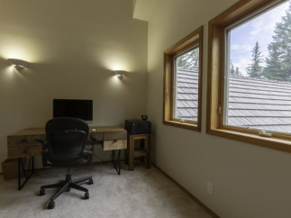 Discover the perfect home office setup in this bright and airy space.