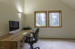 Discover the perfect home office setup in this bright and airy space.