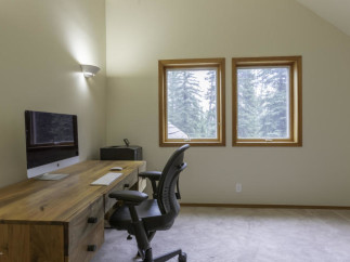 Discover the perfect home office setup in this bright and airy space.