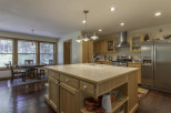 This stunning kitchen boasts a spacious island, perfect for meal prep and entertaining.