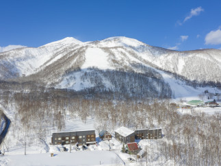 Nestled in a snowy mountainside, this stunning property offers breathtaking views and easy access to winter sports.