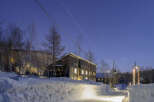 Luxury lodge nestled in a snowy landscape, offering breathtaking views and serene ambiance.