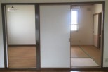 This spacious property features two sliding doors, offering versatile room configurations.