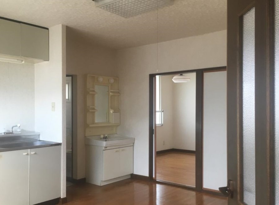 This cozy apartment features a well-equipped kitchen with ample cabinet space and a modern sink.