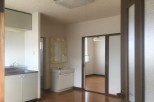 This cozy apartment features a well-equipped kitchen with ample cabinet space and a modern sink.