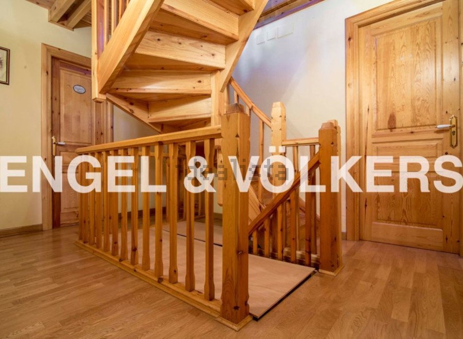 This stunning property boasts a beautiful wooden staircase, adding a touch of elegance to the home.