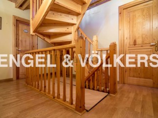 This stunning property boasts a beautiful wooden staircase, adding a touch of elegance to the home.