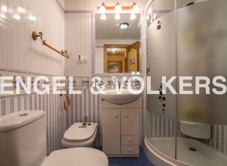 Charming bathroom with a modern shower and classic design.