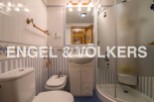 Charming bathroom with a modern shower and classic design.