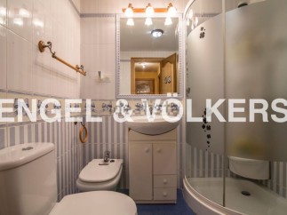 Charming bathroom with a modern shower and classic design.