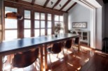This stunning chalet boasts a spacious dining area with a large wooden table perfect for family gatherings.