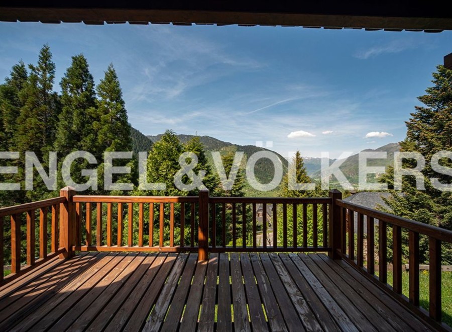 Mountain view from a wooden deck.