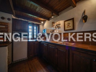Rustic charm meets modern convenience in this charming kitchen.
