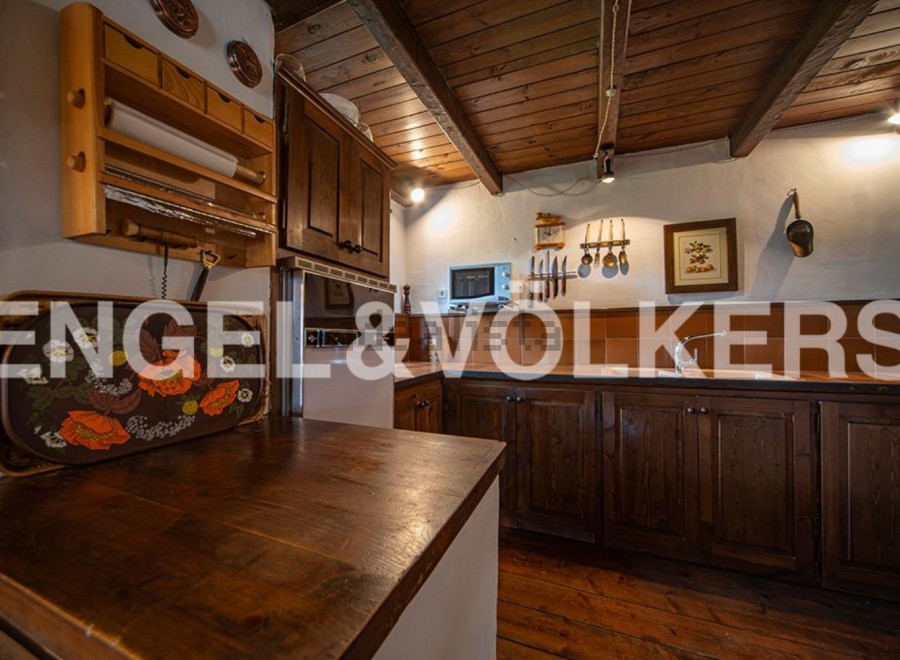 Rustic kitchen with wooden cabinets and countertops, offering a charming and cozy atmosphere.
