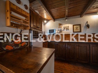 Rustic kitchen with wooden cabinets and countertops, offering a charming and cozy atmosphere.