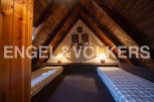 Charming attic room with two twin beds, perfect for children or guests.