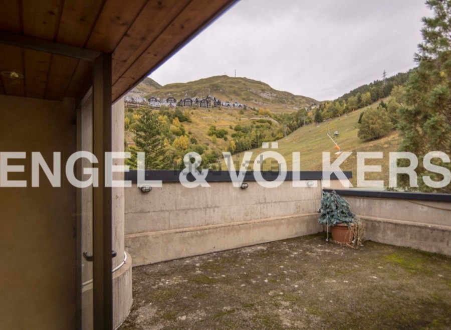 This stunning property boasts a private terrace with breathtaking mountain views.