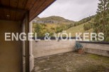 This stunning property boasts a private terrace with breathtaking mountain views.