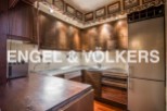 Charming kitchen with rustic wooden cabinetry and stainless steel countertops.