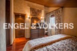 Charming bedroom with wooden floors and rustic decor.