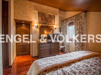 Charming bedroom with wooden floors and rustic decor.