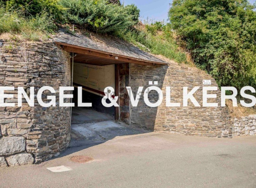 Discover this unique property featuring a charming stone-built garage tucked away in a hillside setting.