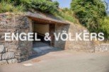 Discover this unique property featuring a charming stone-built garage tucked away in a hillside setting.