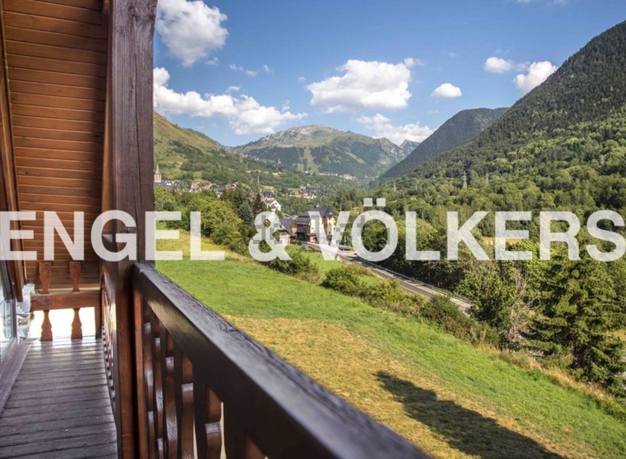 Mountain view chalet with spacious balcony.