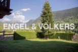 Mountain views and a private garden enhance this charming property.