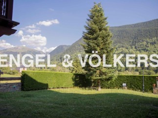 Mountain views and a private garden enhance this charming property.