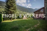 Mountainside property with stunning views and a spacious garden.