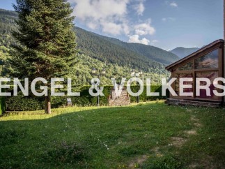 Mountainside property with stunning views and a spacious garden.