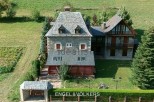 This stunning stone property boasts a main house with a slate roof, plus a charming secondary building.