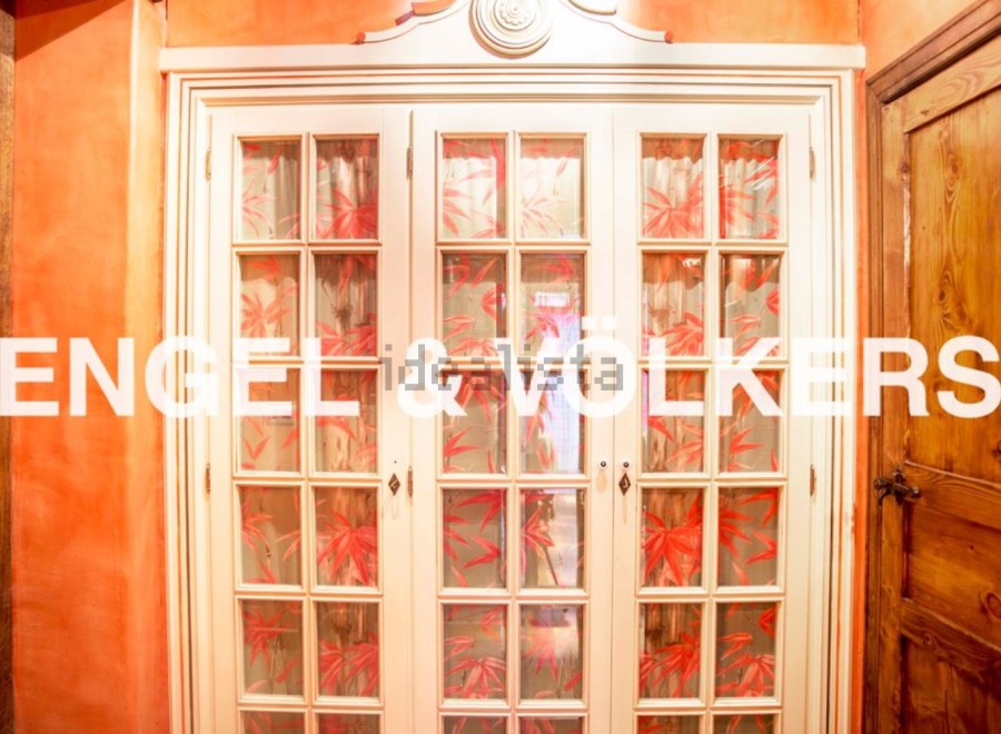 This stunning property boasts exquisite details, including a unique built-in wardrobe with beautiful, hand-painted glass panels.