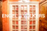 This stunning property boasts exquisite details, including a unique built-in wardrobe with beautiful, hand-painted glass panels.
